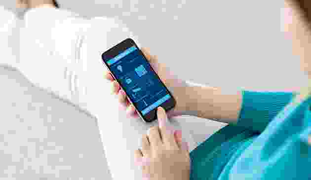 Person using a health app on a smartphone. Person using a health app on a smartphone.