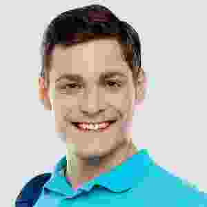 Young man smiling in a blue shirt. Young man smiling in a blue shirt.