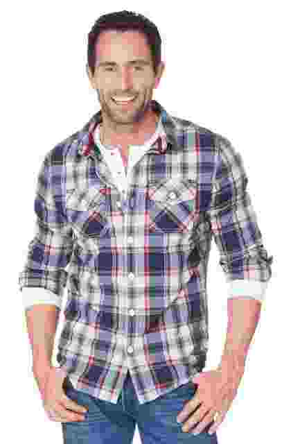 Man wearing a casual plaid shirt and smiling. Man wearing a casual plaid shirt and smiling.