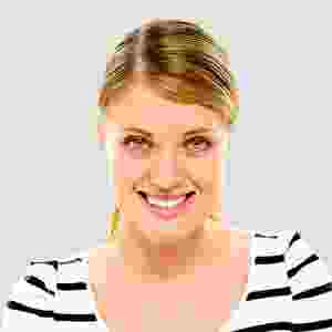 Smiling woman with blonde hair wearing a striped shirt. Smiling woman with blonde hair wearing a striped shirt.