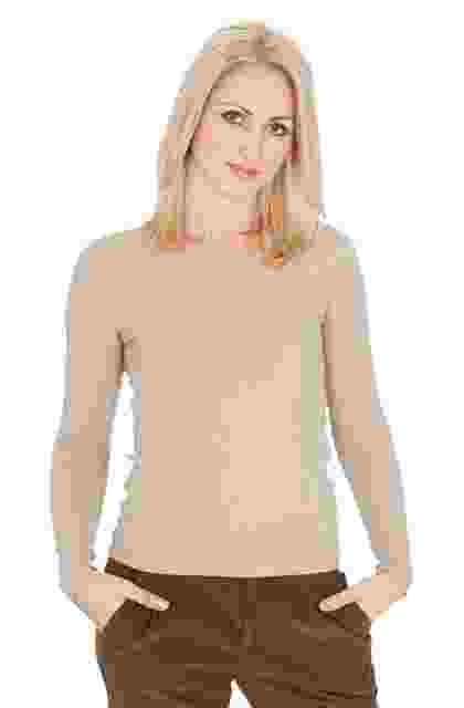 Smiling woman with straight blonde hair wearing a beige sweater and brown pants. Smiling woman with straight blonde hair wearing a beige sweater and brown pants.