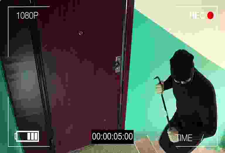 Person opening a door in a dimly lit hallway. Person opening a door in a dimly lit hallway.