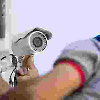 Person holding a handheld barcode scanner. Person holding a handheld barcode scanner.