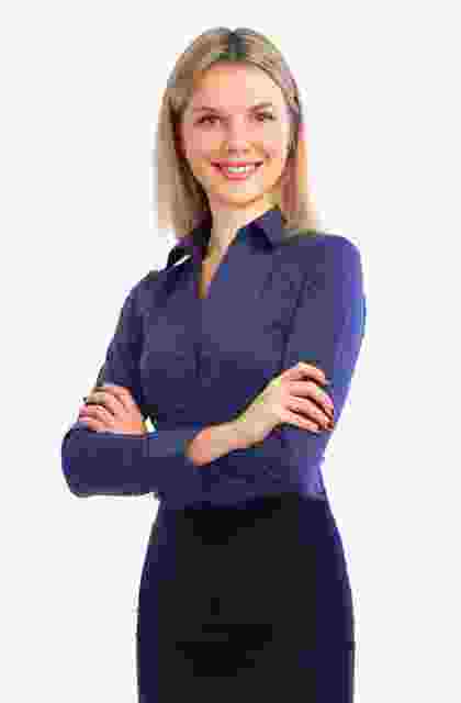 Confident woman standing with arms crossed, smiling. Confident woman standing with arms crossed, smiling.