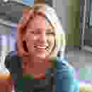 Smiling woman with blonde hair in a casual indoor setting. Smiling woman with blonde hair in a casual indoor setting.