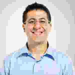 Smiling man wearing glasses and a light blue shirt. Smiling man wearing glasses and a light blue shirt.