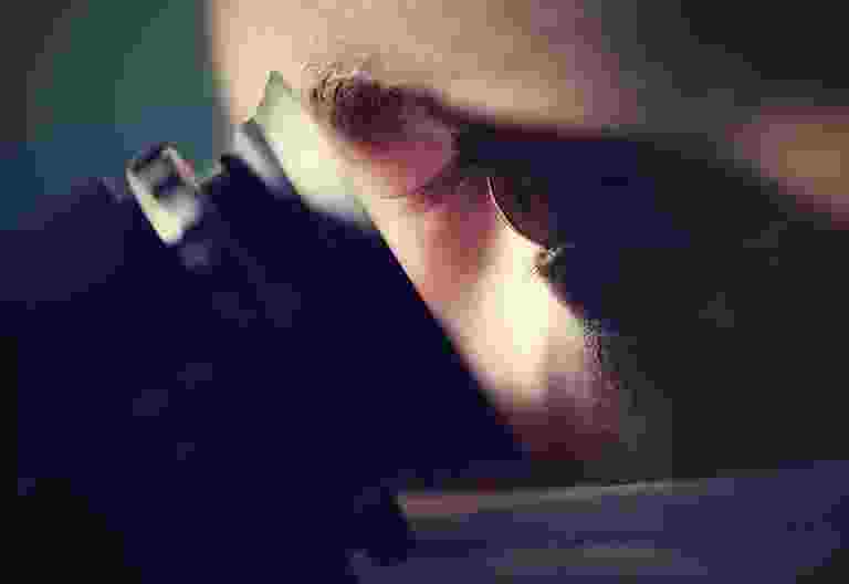 Close-up of a hand pressing a key on a keyboard. Close-up of a hand pressing a key on a keyboard.
